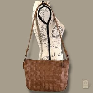 The Sak Elliott Lucca tan woven faux leather crossbody bag